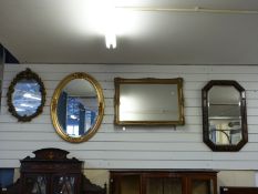 Four mirrors including an oval example with bevelled edge
