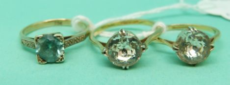 Two 9ct gold and silver rings and a 9ct gold ring set with a zircon