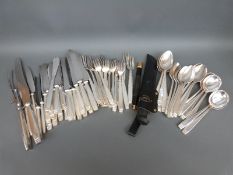 An eight place setting canteen of Elkington silver plated cutlery, includes carving set, reg no,