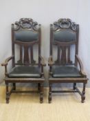 A pair of carved oak chairs