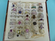 Over 40 silver rings set with various gemstones and filigree rings etc
