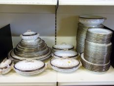 An extensive Cauldon dinner service including six tureens, fifteen graduated oval plates,