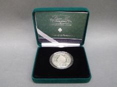 A cased Queen Mother centenary year silver Piedfort crown with booklet and certificate