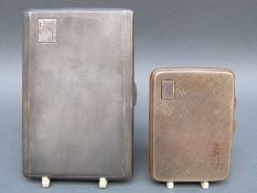 An engine turned hallmarked silver cigarette case and a smaller silver gilt example,