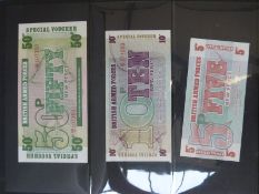 A folder containing a collection of world bank notes,
