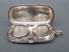 An Edward VII hallmarked silver double sovereign case with engraved decoration,