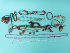 A silver and turquoise pendant, amethyst geode, ivory beaded necklace, mother of pearl necklace,