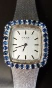 Cyma by Synchron ladies wristwatch with 30 sapphires to the bezel, black hands and baton markers,