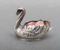 A George V hallmarked silver novelty miniature pin cushion formed as a swan, Birmingham 1910,