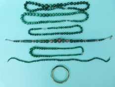 Six malachite beaded necklaces and a malachite bangle