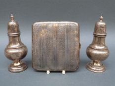 A pair of George V hallmarked silver peppers, Birmingham 1915 maker Jones & Crompton, height 10cm,