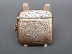 An Edward VII hallmarked silver vesta case with engraved decoration,