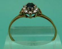 A 9ct gold ring set with sapphires and diamonds,
