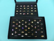 Over 60 rings set with various gemstones