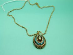 A yellow metal rope twist necklace and a Victorian pendant set with turquoise and seed pearls,