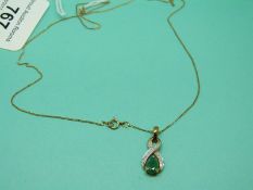 A 9ct gold chain and a 9ct gold pendant set with an emerald and diamonds