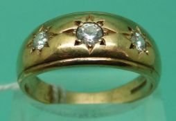 A 9ct gold ring set with three clear stones (Size W)