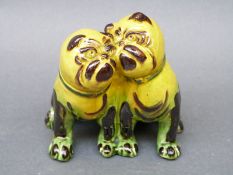 A CH Brannam Barum Pottery model of two dogs,