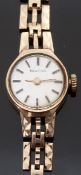 Bulova 9ct gold ladies wristwatch, on 9ct gold bracelet, case diameter 15mm, 12.2g.