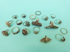 Eighteen silver and white metal rings set with marcasite,