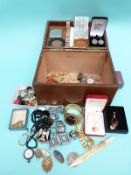 A collection of costume jewellery to include a fob watch, early plastic buttons, brooches, compact,