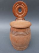 A turned pear wood wall mounted salt barrel,