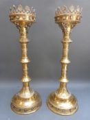 A pair of large ornate brass candlesticks, possibly ecclesiastical, height 49.