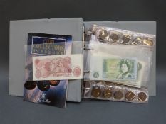 A folder containing an amateur UK coin collection, includes bank notes ten shilling to five pounds,