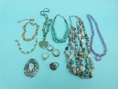 Turquoise necklace, amethyst necklace, two silver rings,