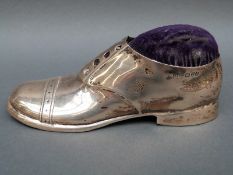 An Edward VII hallmarked silver novelty shoe pin cushion, Chester 1909 maker S.