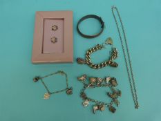 A silver charm bracelet, a silver curb link bracelet,