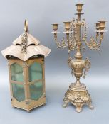 An Art Nouveau brass lantern with wavy top, height 50cm, together with a brass candelabra,
