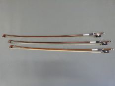 Three violin bows with mother of pearl inlay to frogs