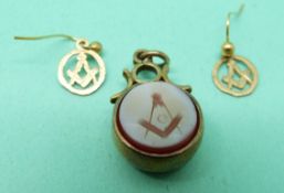 A yellow metal intaglio seal with Masonic emblem with compass verso together with a pair of 9ct