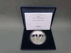 A 5oz silver 2005 The Ashes Winners cased commemorative coin,