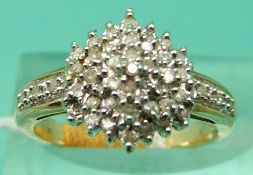 A 9ct gold ring set with diamonds in a cluster (Size J)
