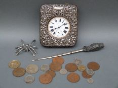 A nickel Goliath pocket watch in a hallmarked silver embossed case, an owl letter opener, coins,