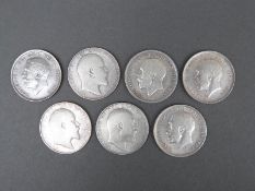 Seven pre-1920 crowns in various grades comprising three Edward VII and four George V examples