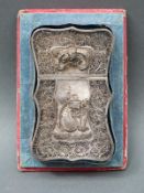 A 19thC Chinese filigree silver card case decorated with dragons, flowers verso and pierced border,