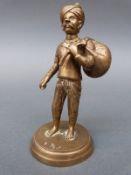 Jaipur School of Art brass figure of an Indian man with Turban and swag bag, height 11.
