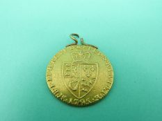 A 1795 gold spade guinea on hoop mount, weight 8.