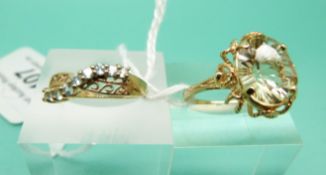 A 9ct gold ring set with a large citrine and a 9ct gold ring set with paste
