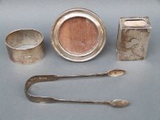 A collection of hallmarked silver items to include napkin ring, matchbox holder,