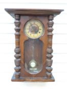 A 19th/20th century walnut Vienna regulator style wall clock.