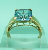 Three 9ct gold rings set with blue topaz
