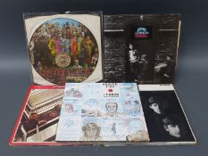 Thirteen Beatles and assorted LPs including a Sgt Pepper picture disc,
