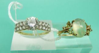 A 9ct gold ring set with a green cabochon and a 14ct gold ring set with cubic zirconia