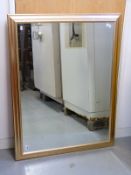 A bevelled glass mirror,