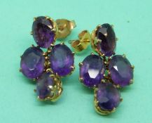 A pair of Victorian earrings set with four amethysts to each
