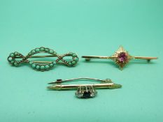 A 9ct gold brooch set with a sapphire, a turquoise brooch and a gold plated example.